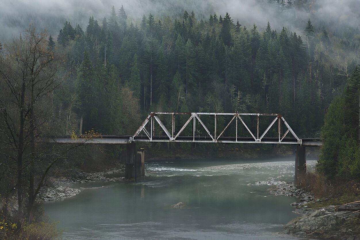 Bridge construction in Alaska during extreme winter weather with snow and ice challenges